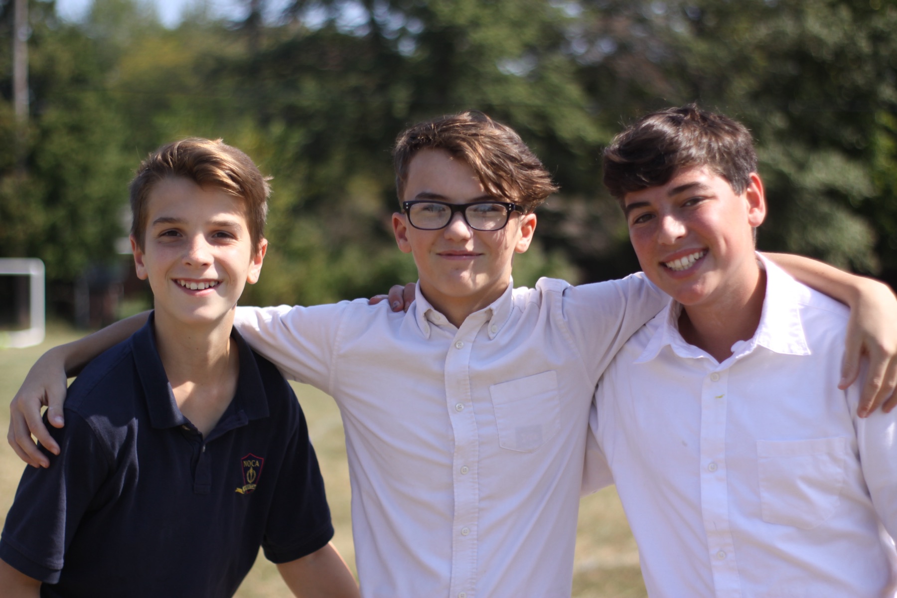 NOCA students in uniform together outside school.